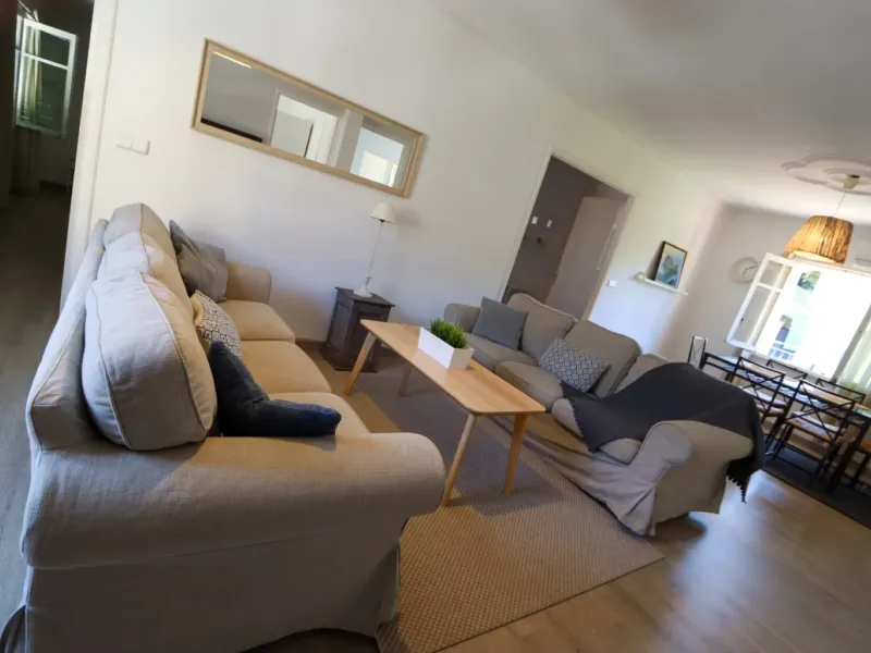 A two-apartment house on a quiet street, featuring a private pool