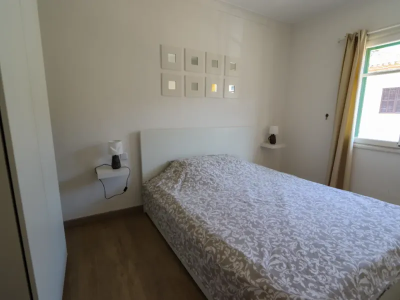 A two-apartment house on a quiet street, featuring a private pool