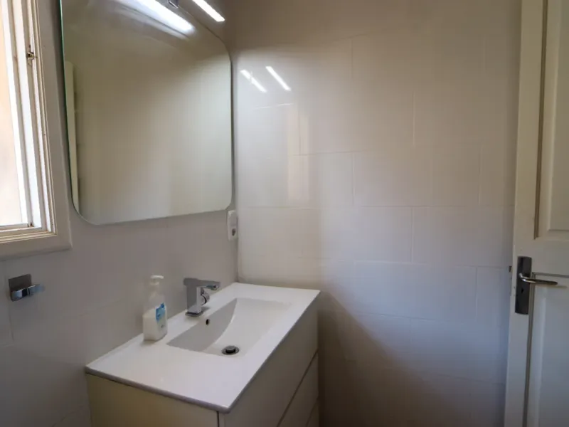 A two-apartment house on a quiet street, featuring a private pool