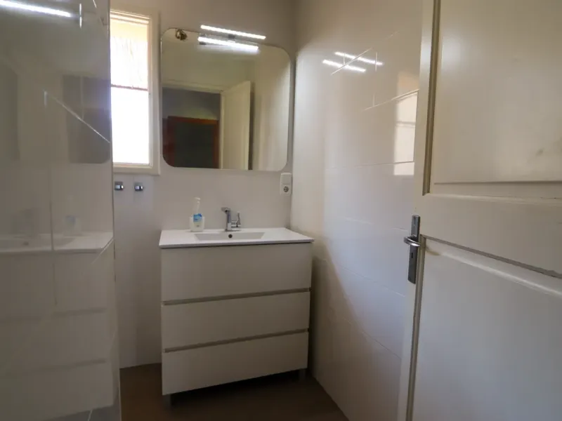 A two-apartment house on a quiet street, featuring a private pool