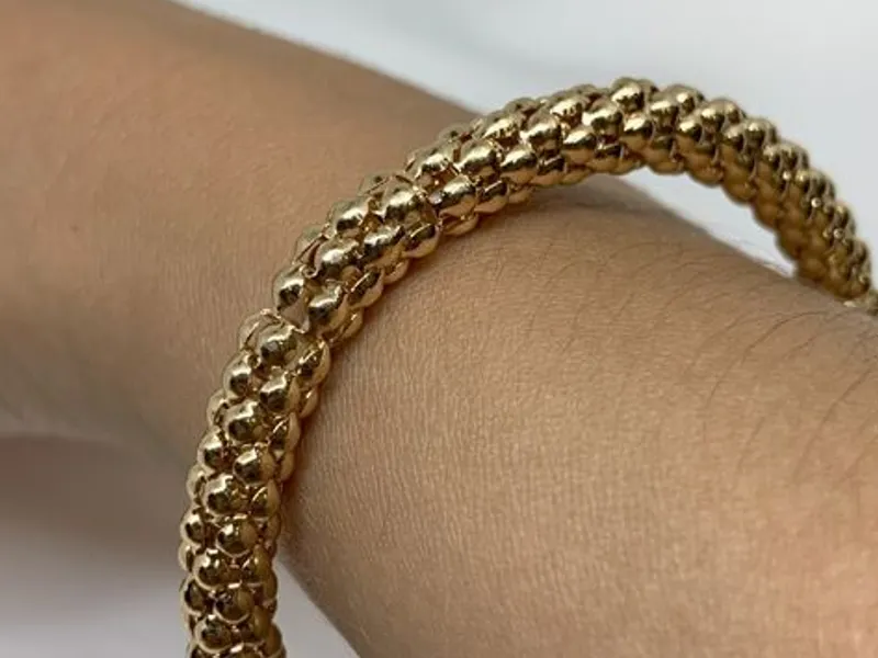 Pulseira Elástica Dourada com Efeito de Esferas - 